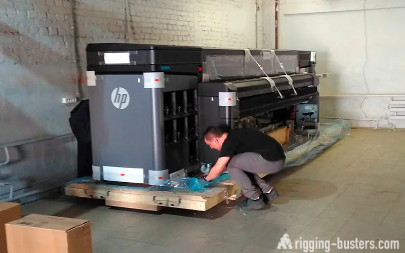Large-format printer on skids, prepared for transport